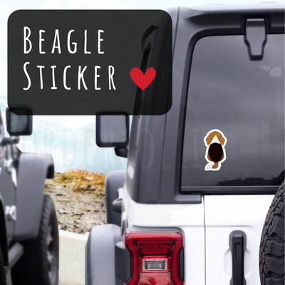 Beagle sticker on a vehicle window with a scenic background